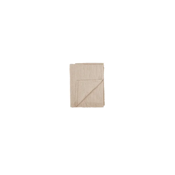 Manta rectangular de algodón texturizado en color gris-beige con flecos sutiles.